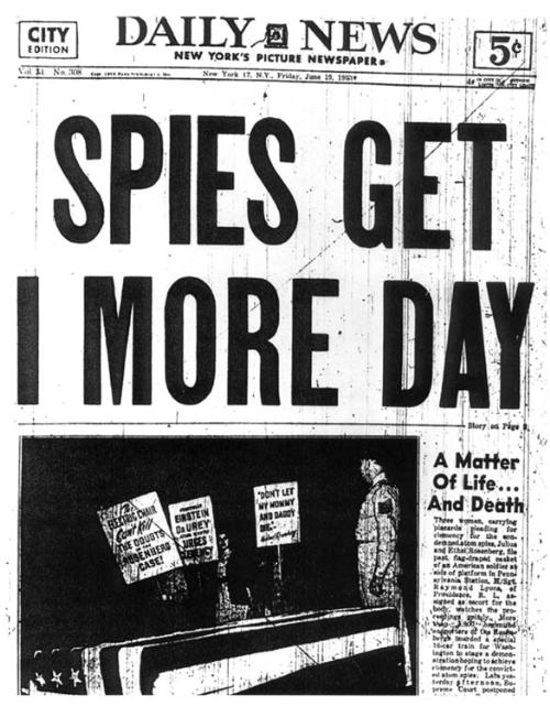 Daily News 
Friday, June 19 1953
Spies Get 1 More Day
A Matter Of Life… And Death
Three women carying placards [One: reads Profesor Einstein Dr. Urey Urges Clemency] pleading for clemency for the condemned atom spies, Julios and Ethel Rosenberg, file past flag draped casket of an American soldier at side of patform in Pennsylvania Staion. m/sgt. Raymond Lyons, of providence, RI, assigned as escort for the body watches the proceedings grinly. More than 900 organized supporters of the Rosenbergs Boarded a special 16-car train for Washington to stage a demonstration hoping to achieve clemency for the convicted atom spies.…
