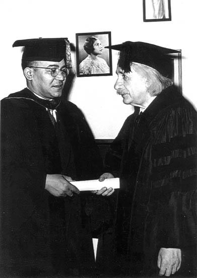 Einstein receives honorary degree from Horace Mann Bond President of Lincoln University. The photo on wall is Marian Anderson.
Courtesy, Langston Hughes Memorial Library at Lincoln University in Pennsylvania

